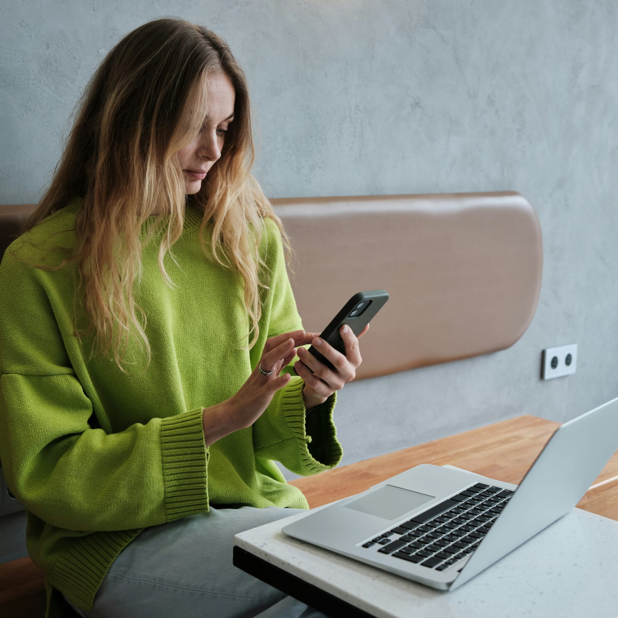 Woman smiling at phone